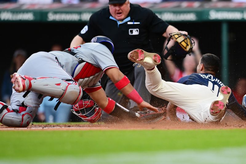 May 31, 2024; Cleveland, Ohio, USA; Washington Nationals catcher Keibert Ruiz (20) can not Mae the tag on Cleveland Guardians shortstop Brayan Rocchio (4) during the third inning at Progressive Field. Mandatory Credit: Ken Blaze-USA TODAY Sports