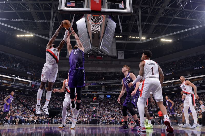 SACRAMENTO, CA - OCTOBER 28: Jerami Grant #9 of the Portland Trail Blazers and Domantas Sabonis #11 of the Sacramento Kings go up for the rebound during the game on October 28, 2024 at Golden 1 Center in Sacramento, California. NOTE TO USER: User expressly acknowledges and agrees that, by downloading and or using this Photograph, user is consenting to the terms and conditions of the Getty Images License Agreement. Mandatory Copyright Notice: Copyright 2024 NBAE (Photo by Rocky Widner/NBAE via Getty Images)