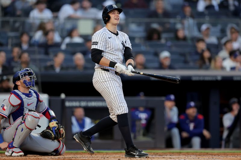May 20, 2025; Bronx, New York, USA; New York Yankees designated hitter Ben Rice (22) watches his solo home run against the Texas Rangers during the second inning at Yankee Stadium. Mandatory Credit: Brad Penner-Imagn Images