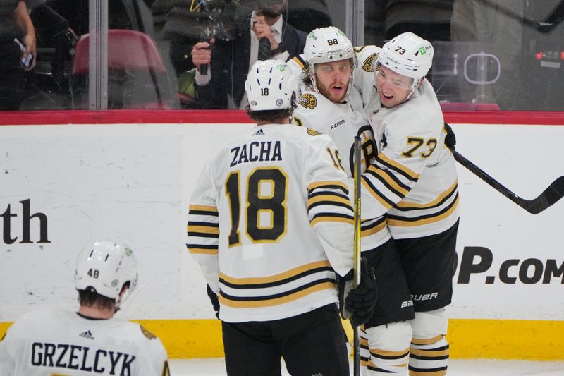 Mar 26, 2024; Sunrise, Florida, USA; Boston Bruins right wing David Pastrnak (88), Boston Bruins defenseman Charlie McAvoy (73) and Boston Bruins center Pavel Zacha (18) celebrate Pasternak’s goal against the Florida Panthers during the second period at Amerant Bank Arena. Mandatory Credit: Jim Rassol-USA TODAY Sports