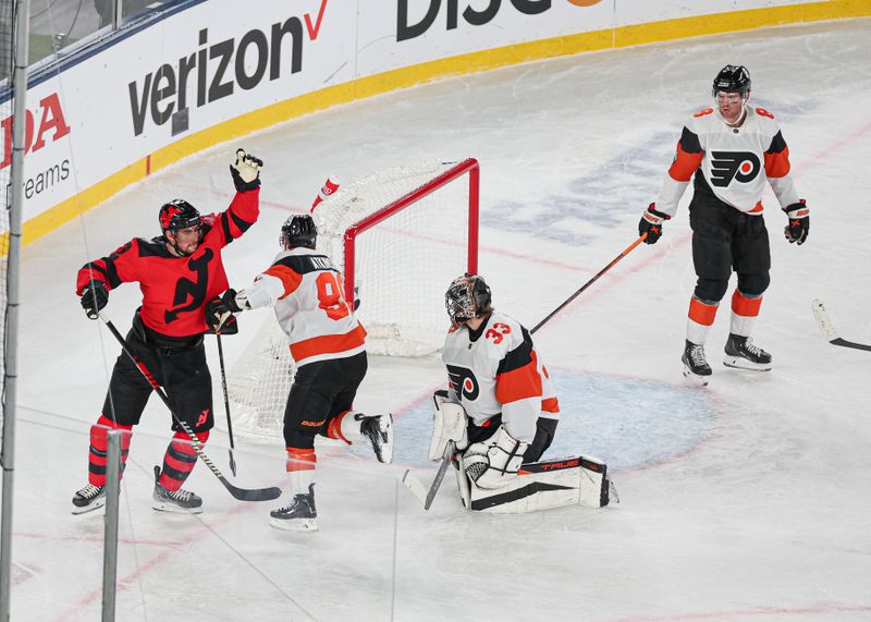 Feb 17, 2024; East Rutherford, New Jersey, USA; New Jersey Devils defenseman Brendan Smith (2) celebrates after scoring a goal past Philadelphia Flyers goaltender Samuel Ersson (33) in a Stadium Series ice hockey game at MetLife Stadium. Mandatory Credit: Vincent Carchietta-USA TODAY Sports