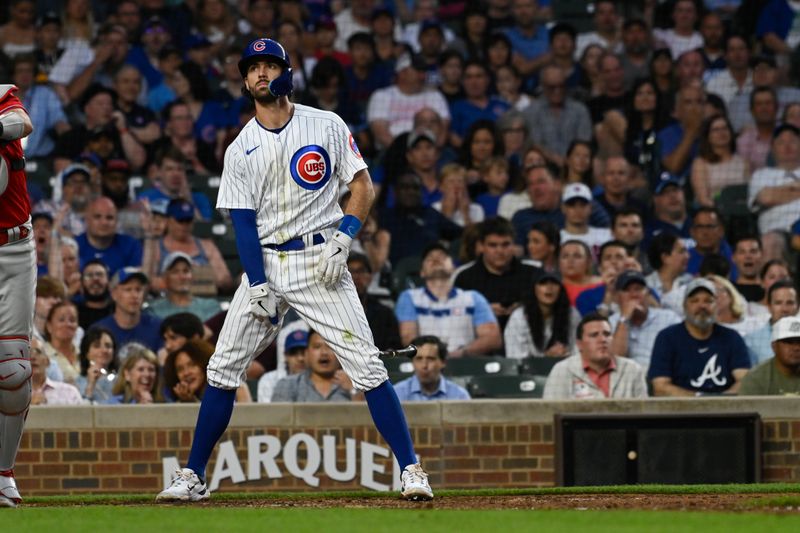 Jun 29, 2023; Chicago, Illinois, USA;  Chicago Cubs shortstop Dansby Swanson (7) flips his bat after being called out on strikes during the fifth inning against the Philadelphia Phillies at Wrigley Field. Mandatory Credit: Matt Marton-USA TODAY Sports