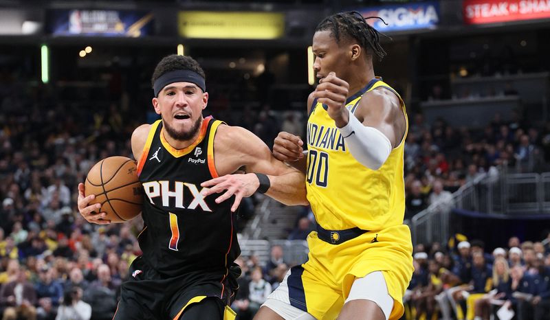 INDIANAPOLIS, INDIANA - JANUARY 26: Devin Booker #1 of the Phoenix Suns dribbles the ball while defended by Bennedict Mathurin #00 of the Indiana Pacers during the first half at Gainbridge Fieldhouse on January 26, 2024 in Indianapolis, Indiana.    NOTE TO USER: User expressly acknowledges and agrees that, by downloading and or using this photograph, User is consenting to the terms and conditions of the Getty Images License Agreement.  (Photo by Andy Lyons/Getty Images)