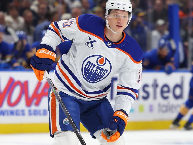 Nov 17, 2025; Buffalo, New York, USA;  Edmonton Oilers center Trent Frederic (10) looks for the puck during the first period against the Buffalo Sabres at KeyBank Center. Mandatory Credit: Timothy T. Ludwig-Imagn Images