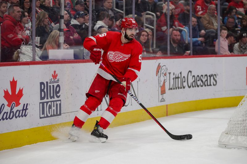 Mar 18, 2023; Detroit, Michigan, USA; Detroit Red Wings defenseman Jake Walman (96) handles the puck behind the net during the first period at Little Caesars Arena. Mandatory Credit: Brian Bradshaw Sevald-USA TODAY Sports