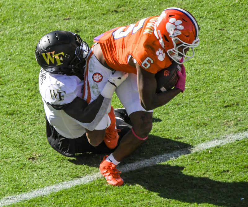 Oct 7, 2023; Clemson, South Carolina, USA; Clemson receiver Tyler Brown (6) is tackled by Wake Forest defensive back AJ Williams  (7) during the first quarter at Memorial Stadium. Mandatory Credit: Ken Ruinard-USA TODAY Sports