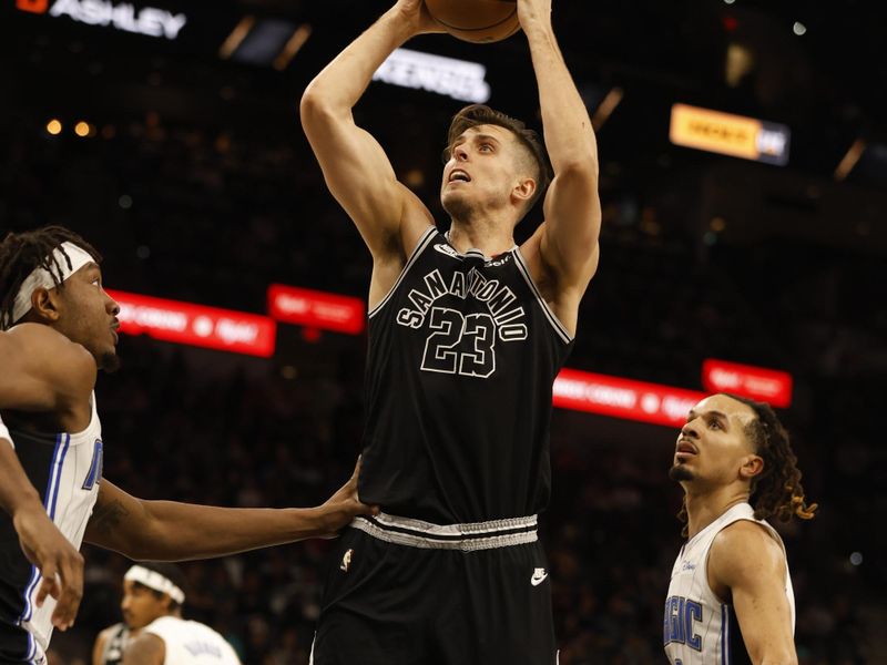 SAN ANTONIO, TX - MARCH 14:  Zach Collins #23 of the San Antonio Spurs shoots against the Orlando Magic in the first half at AT&T Center on March 14, 2023 in San Antonio, Texas. NOTE TO USER: User expressly acknowledges and agrees that, by downloading and or using this photograph, User is consenting to terms and conditions of the Getty Images License Agreement. (Photo by Ronald Cortes/Getty Images)