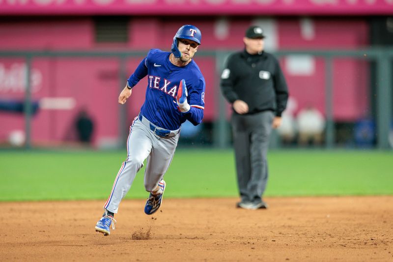 May 4, 2024; Kansas City, Missouri, USA; Texas Rangers third base Josh Smith (8) rounds the bases during the ninth inning against the Kansas City Royals at Kauffman Stadium. Mandatory Credit: William Purnell-USA TODAY Sports