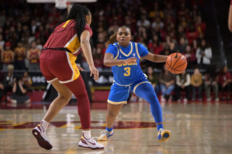 Jan 14, 2024; Los Angeles, California, USA; USC Trojans guard Taylor Bigby (1) defends UCLA Bruins guard Londynn Jones (3) in the first half at Galen Center. Mandatory Credit: Jayne Kamin-Oncea-USA TODAY Sports