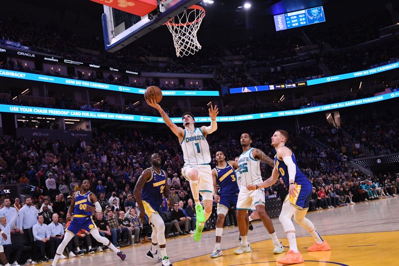 SAN FRANCISCO, CA - DECEMBER 27: LaMelo Ball #1 of the Charlotte Hornets shoots the ball during the game against the Golden State Warriors on December 27, 2022 at Chase Center in San Francisco, California. NOTE TO USER: User expressly acknowledges and agrees that, by downloading and or using this photograph, user is consenting to the terms and conditions of Getty Images License Agreement. Mandatory Copyright Notice: Copyright 2022 NBAE (Photo by Noah Graham/NBAE via Getty Images)