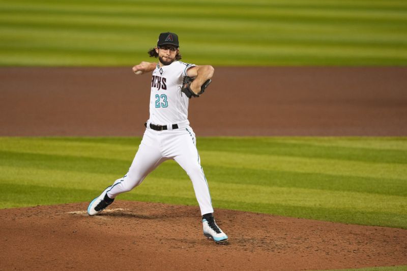 Nov 1, 2023; Phoenix, AZ, USA; Arizona Diamondbacks starting pitcher Zac Gallen (23) pitches in the fifth inning against the Texas Rangers in game five of the 2023 World Series at Chase Field. Mandatory Credit: Joe Camporeale-USA TODAY Sports