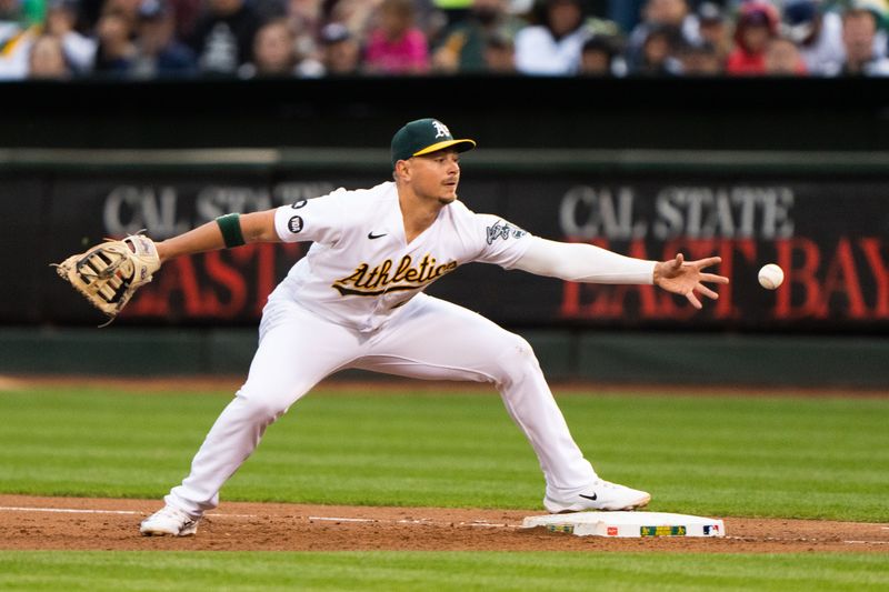 Jun 28, 2023; Oakland, California, USA; Oakland Athletics first baseman Ryan Noda (49) misses the ball during the fifth inning against the New York Yankees at Oakland-Alameda County Coliseum. Mandatory Credit: Stan Szeto-USA TODAY Sports