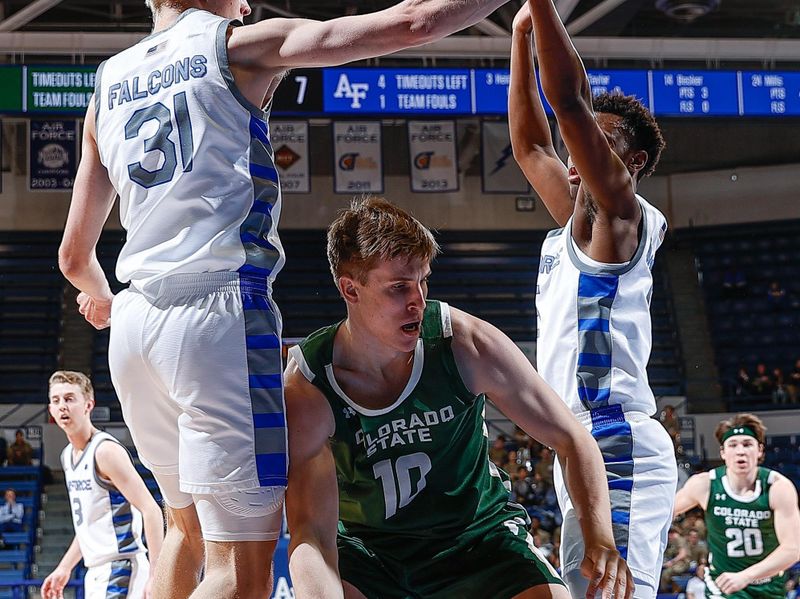 Feb 7, 2023; Colorado Springs, Colorado, USA; Colorado State Rams forward James Moors (10) controls the ball under pressure from Air Force Falcons forward Rytis Petraitis (31) and guard Ethan Taylor (5) in the first half at Clune Arena. Mandatory Credit: Isaiah J. Downing-USA TODAY Sports