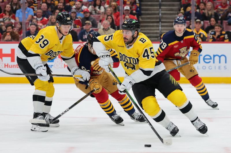 Feb 4, 2026; Sunrise, Florida, USA; Boston Bruins defenseman Jonathan Aspirot (45) moves the puck against the Florida Panthers during the first period at Amerant Bank Arena. Mandatory Credit: Sam Navarro-Imagn Images