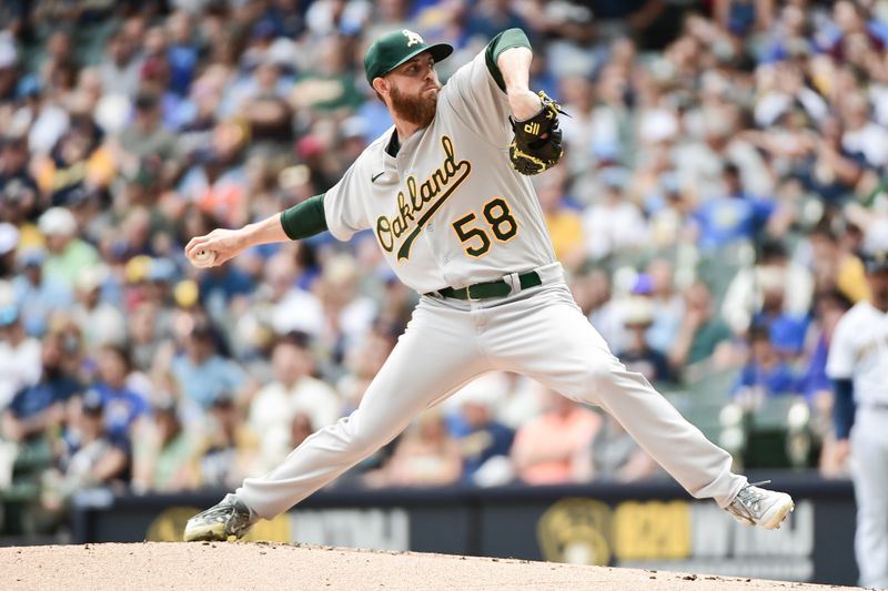 Jun 10, 2023; Milwaukee, Wisconsin, USA; Oakland Athletes pitcher Paul Blackburn (58) pitches against the Milwaukee Brewers in the first inning at American Family Field. Mandatory Credit: Benny Sieu-USA TODAY Sports