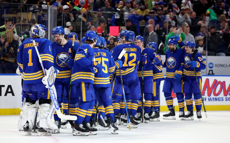 Mar 15, 2025; Buffalo, New York, USA;  The Buffalo Sabres celebrate a win over the Vegas Golden Knights at KeyBank Center. Mandatory Credit: Timothy T. Ludwig-Imagn Images