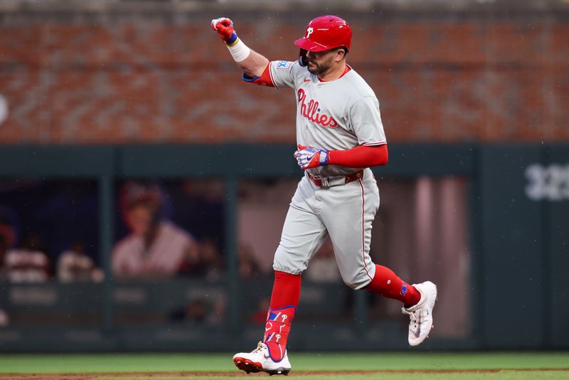 Apr 10, 2025; Atlanta, Georgia, USA; Philadelphia Phillies designated hitter Kyle Schwarber (12) celebrates after a home run against the Atlanta Braves in the third inning at Truist Park. Mandatory Credit: Brett Davis-Imagn Images