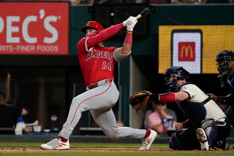 Sep 6, 2024; Arlington, Texas, USA; Los Angeles Angels catcher Logan O'Hoppe (14) hits a three-run home run during the sixth inning against the Texas Rangers at Globe Life Field. Mandatory Credit: Raymond Carlin III-Imagn Images