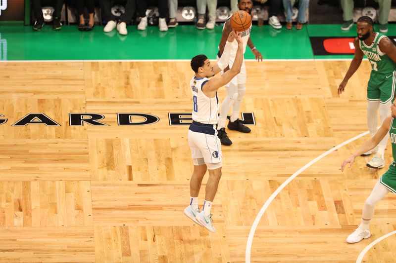 BOSTON, MA - JUNE 17: Josh Green #8 of the Dallas Mavericks shoots a three point basket during the game  against the Boston Celtics during Game 5 of the 2024 NBA Finals on June 17, 2024 at the TD Garden in Boston, Massachusetts. NOTE TO USER: User expressly acknowledges and agrees that, by downloading and or using this photograph, User is consenting to the terms and conditions of the Getty Images License Agreement. Mandatory Copyright Notice: Copyright 2024 NBAE  (Photo by Stephen Gosling/NBAE via Getty Images)