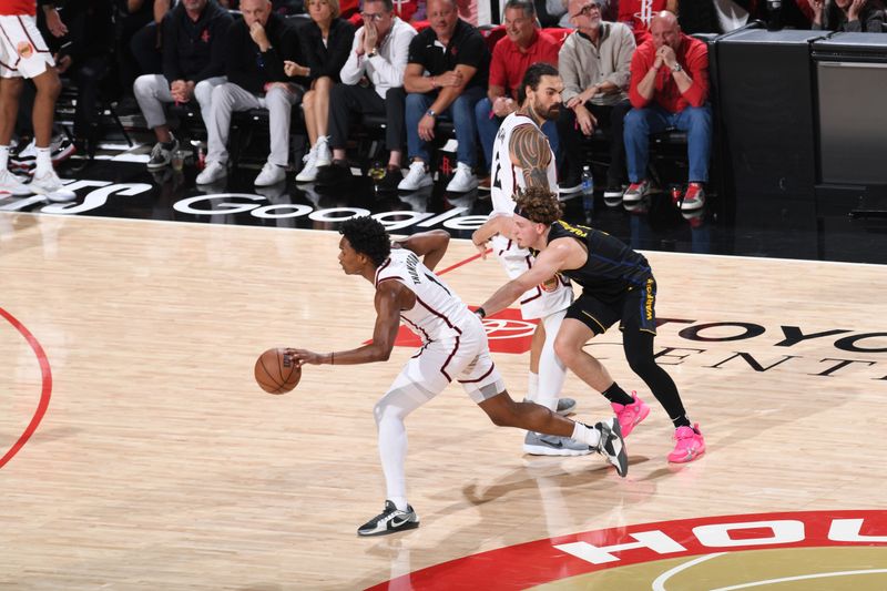 HOUSTON, TX - MAY 4:  Amen Thompson #1 of the Houston Rockets dribbles the ball during the game against the Golden State Warriors during Round 1 Game 7 of the 2025 NBA Playoffs on February 1, 2025 at the Toyota Center in Houston, Texas. NOTE TO USER: User expressly acknowledges and agrees that, by downloading and or using this photograph, User is consenting to the terms and conditions of the Getty Images License Agreement. Mandatory Copyright Notice: Copyright 2025 NBAE (Photo by Noah Graham/NBAE via Getty Images)