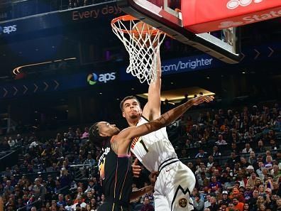 PHOENIX, AZ - DECEMBER 1: Michael Porter Jr. #1 of the Denver Nuggets dunks the ball during the game against the Phoenix Suns on December 1, 2023 at Footprint Center in Phoenix, Arizona. NOTE TO USER: User expressly acknowledges and agrees that, by downloading and or using this photograph, user is consenting to the terms and conditions of the Getty Images License Agreement. Mandatory Copyright Notice: Copyright 2023 NBAE (Photo by Kate Frese/NBAE via Getty Images)