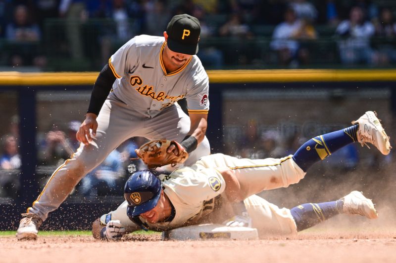 May 15, 2024; Milwaukee, Wisconsin, USA; Milwaukee Brewers right fielder Sal Frelick (10) slides into second base for a double before the tag by Pittsburgh Pirates second baseman Nick Gonzales (39) at American Family Field. Mandatory Credit: Benny Sieu-USA TODAY Sports