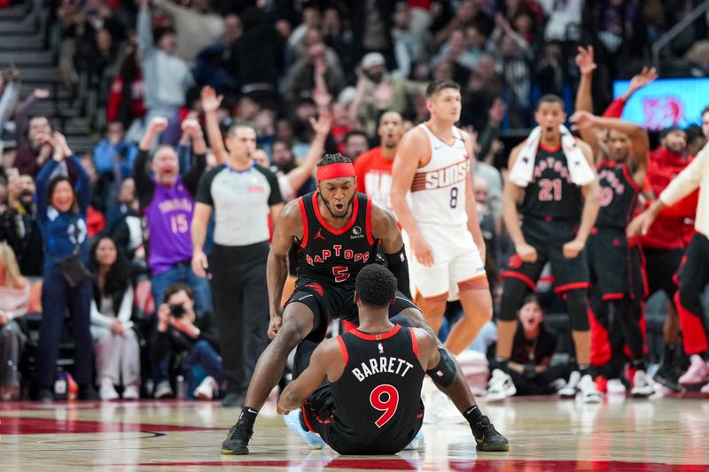 TORONTO, CANADA - FEBRUARY 23: Immanuel Quickley #5 of the Toronto Raptors celebrates RJ Barrett #9 three point bucket against the Phoenix Suns during the second half at Scotiabank Arena on February 23, 2025 in Toronto, Canada. NOTE TO USER: User expressly acknowledges and agrees that, by downloading and or using this photograph, User is consenting to the terms and conditions of the Getty Images License Agreement. (Photo by Kevin Sousa/Getty Images)