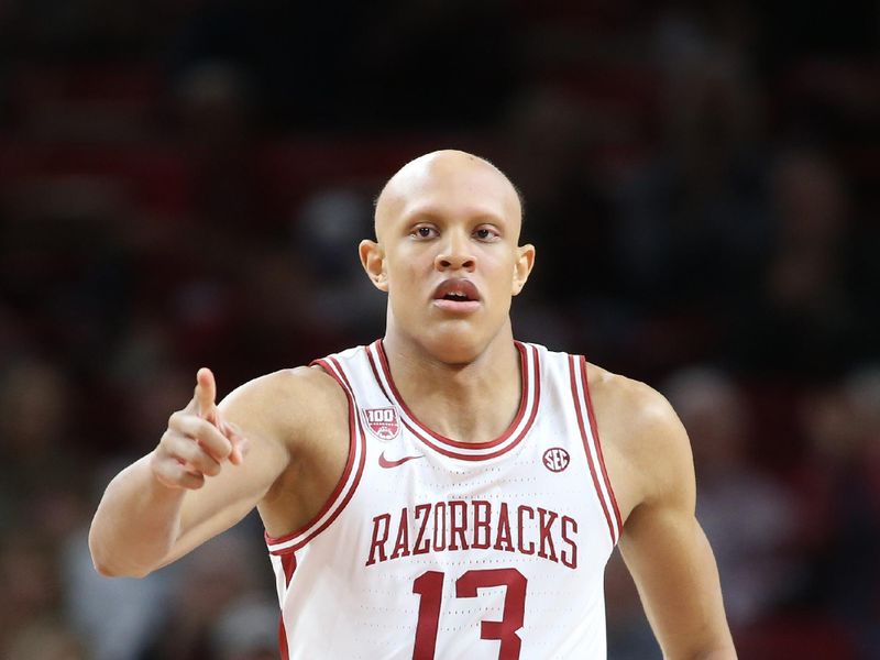 Nov 16, 2022; Fayetteville, Arkansas, USA; Arkansas Razorbacks guard Jordan Walsh (13) celebrates after scoring in the first half against the South Dakota State Jackrabbits at Bud Walton Arena. Mandatory Credit: Nelson Chenault-USA TODAY Sports