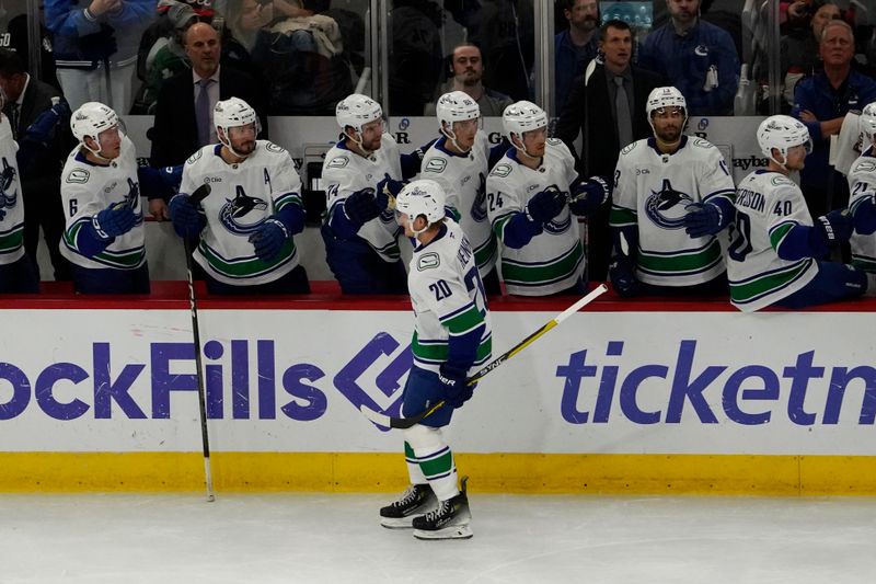 Oct 22, 2024; Chicago, Illinois, USA; Vancouver Canucks left wing Danton Heinen (20) celebrates his goal against the Chicago Blackhawks during the first period at United Center. Mandatory Credit: David Banks-Imagn Images