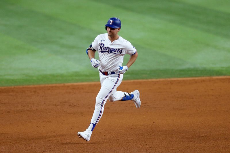 Oct 10, 2023; Arlington, Texas, USA; Texas Rangers first baseman Nathaniel Lowe (30) runs after hitting a home run in the sixth inning against the Baltimore Orioles during game three of the ALDS for the 2023 MLB playoffs at Globe Life Field. Mandatory Credit: Andrew Dieb-USA TODAY Sports