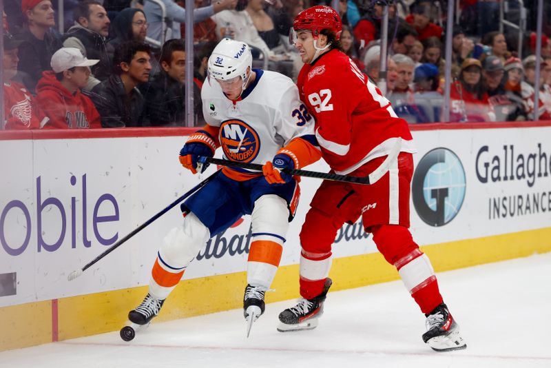 Dec 16, 2025; Detroit, Michigan, USA;  New York Islanders center Kyle MacLean (32) and Detroit Red Wings center Marco Kasper (92) battle for the puck in the first period at Little Caesars Arena. Mandatory Credit: Rick Osentoski-Imagn Images