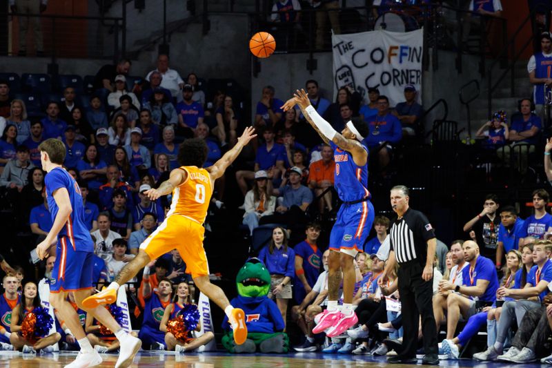 Jan 10, 2026; Gainesville, Florida, USA; Florida Gators guard Boogie Fland (0) shoots over Tennessee Volunteers guard Ja'kobi Gillespie (0) during the first half at Exactech Arena at the Stephen C. O'Connell Center. Mandatory Credit: Matt Pendleton-Imagn Images