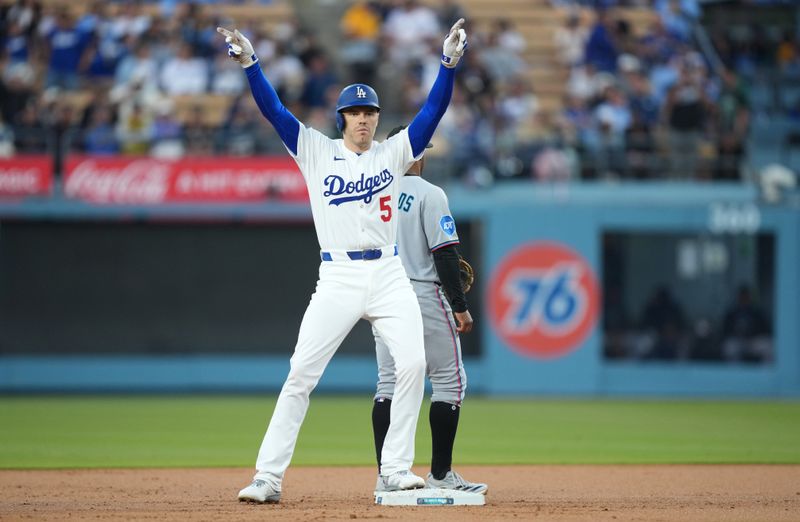Apr 29, 2025; Los Angeles, California, USA; Los Angeles Dodgers first baseman Freddie Freeman (5) celebrates after a double during the first inning against the Miami Marlins at Dodger Stadium. Mandatory Credit: Kirby Lee-Imagn Images