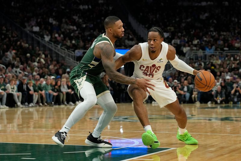 MILWAUKEE, WISCONSIN - NOVEMBER 02: Damian Lillard #0 of the Milwaukee Bucks defends Isaac Okoro #35 of the Cleveland Cavaliers during the second quarter of a game at Fiserv Forum on November 02, 2024 in Milwaukee, Wisconsin. NOTE TO USER: User expressly acknowledges and agrees that, by downloading and or using this photograph, User is consenting to the terms and conditions of the Getty Images License Agreement. (Photo by Patrick McDermott/Getty Images)