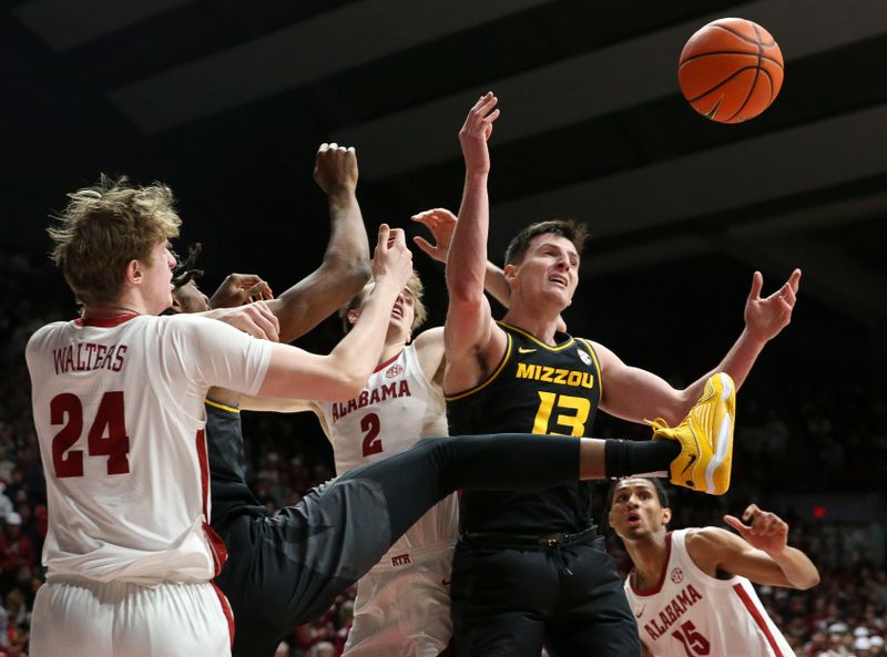 Jan 16, 2024; Tuscaloosa, Alabama, USA; Alabama forward Sam Walters (24), Alabama forward Grant Nelson (2), and Missouri forward Jesus Carralero Martin (13) fight for control of a rebound in the game at Coleman Coliseum. Mandatory Credit: Gary Cosby Jr.-USA TODAY Sports