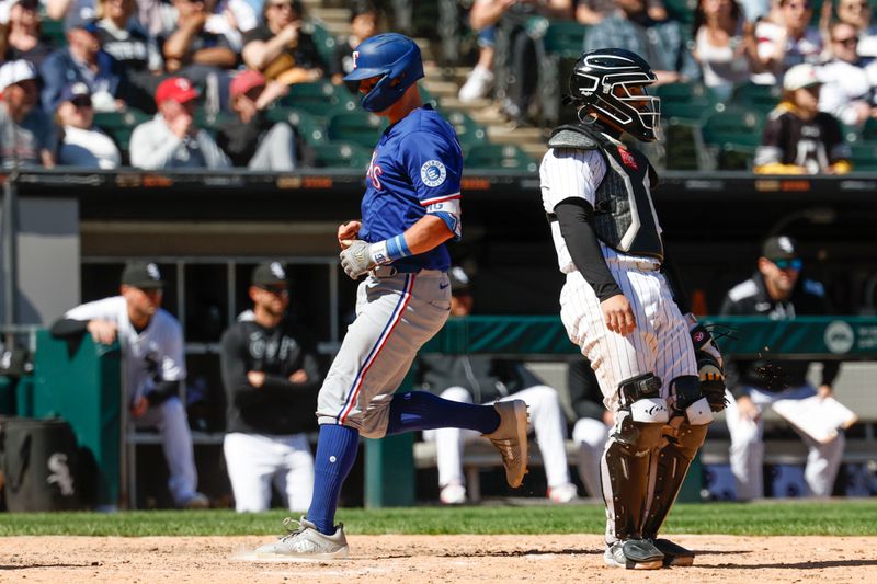 May 25, 2025; Chicago, Illinois, USA; Texas Rangers third baseman Josh Jung (6) scores against the Chicago White Sox during the ninth inning at Rate Field. Mandatory Credit: Kamil Krzaczynski-Imagn Images