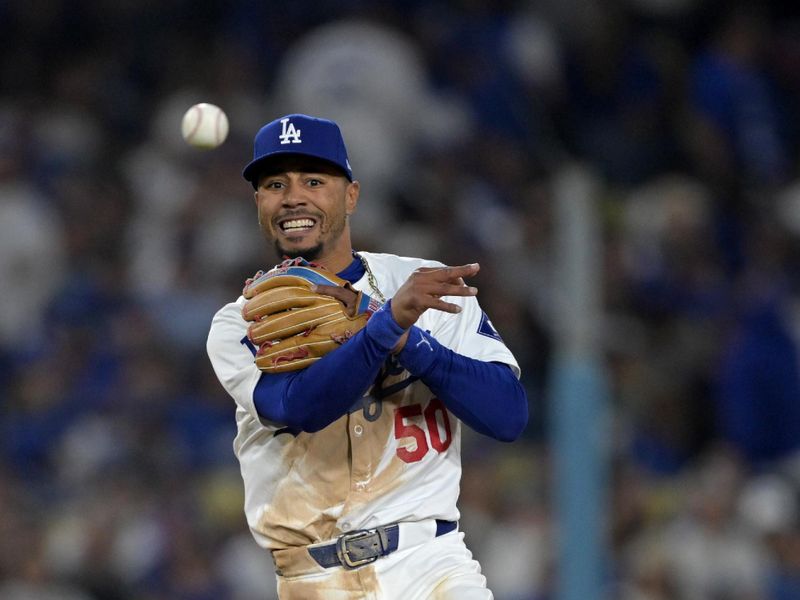 Apr 2, 2024; Los Angeles, California, USA;  Los Angeles Dodgers shortstop Mookie Betts (50) throws San Francisco Giants shortstop Nick Ahmed (16) out at first in the seventh inning at Dodger Stadium. Mandatory Credit: Jayne Kamin-Oncea-USA TODAY Sports