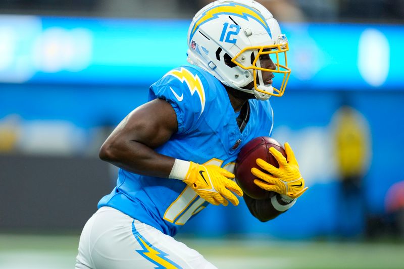 Los Angeles Chargers wide receiver Derius Davis (12) returns the opening kickoff in the first half of an NFL football game against the New Orleans Saints in Inglewood, Calif., Sunday, Aug. 20, 2023. (AP Photo/Marcio Jose Sanchez)