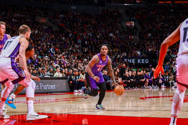 TORONTO, CANADA - NOVEMBER 2: Davion Mitchell #45 of the Toronto Raptors drives to the basket during the game against the Sacramento Kings on November 2, 2024 at the Scotiabank Arena in Toronto, Ontario, Canada.  NOTE TO USER: User expressly acknowledges and agrees that, by downloading and or using this Photograph, user is consenting to the terms and conditions of the Getty Images License Agreement.  Mandatory Copyright Notice: Copyright 2024 NBAE (Photo by Vaughn Ridley/NBAE via Getty Images)