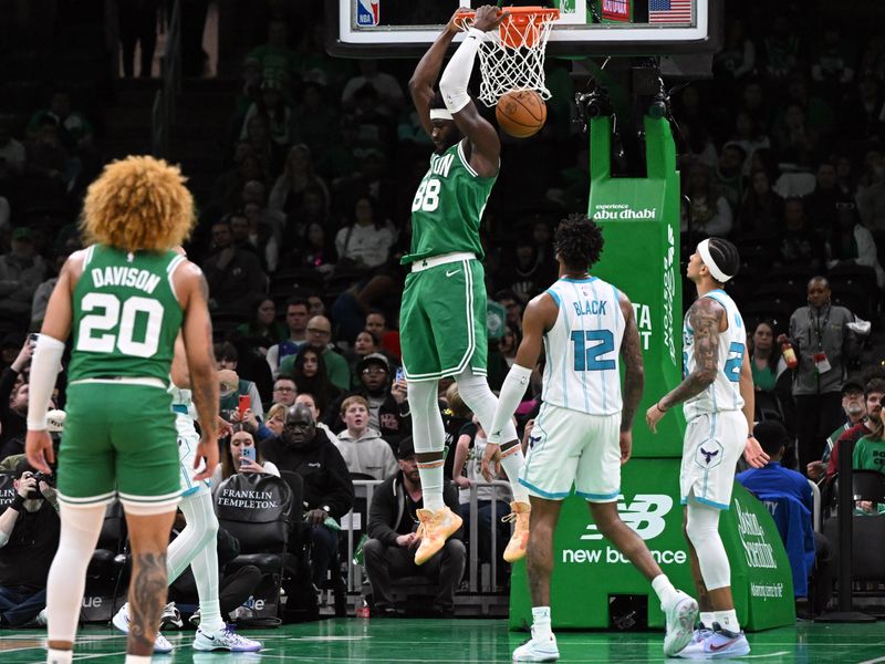 BOSTON, MASSACHUSETTS - APRIL 12: Neemias Queta #88 of the Boston Celtics dunks and scores against the Charlotte Hornets during the fourth quarter at the TD Garden on April 12, 2024 in Boston, Massachusetts. NOTE TO USER: User expressly acknowledges and agrees that, by downloading and or using this photograph, User is consenting to the terms and conditions of the Getty Images License Agreement. (Photo by Brian Fluharty/Getty Images)