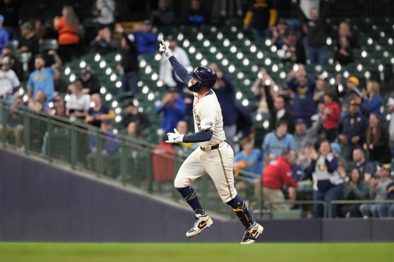 May 9, 2024; Milwaukee, Wisconsin, USA;  Milwaukee Brewers first baseman Rhys Hoskins (12) celebrates after hitting a home run during the first inning against the St. Louis Cardinals at American Family Field. Mandatory Credit: Jeff Hanisch-USA TODAY Sports