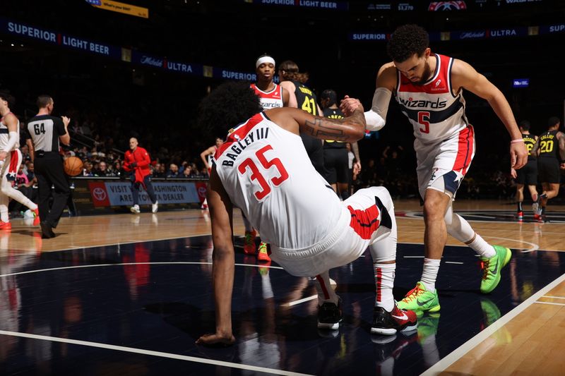 WASHINGTON, DC -? JANUARY 25: Marvin Bagley III #35 of the Washington Wizards is helped up by Tyus Jones #5 during the game against the Utah Jazz on January 25, 2024 at Capital One Arena in Washington, DC. NOTE TO USER: User expressly acknowledges and agrees that, by downloading and or using this Photograph, user is consenting to the terms and conditions of the Getty Images License Agreement. Mandatory Copyright Notice: Copyright 2024 NBAE (Photo by Stephen Gosling/NBAE via Getty Images)