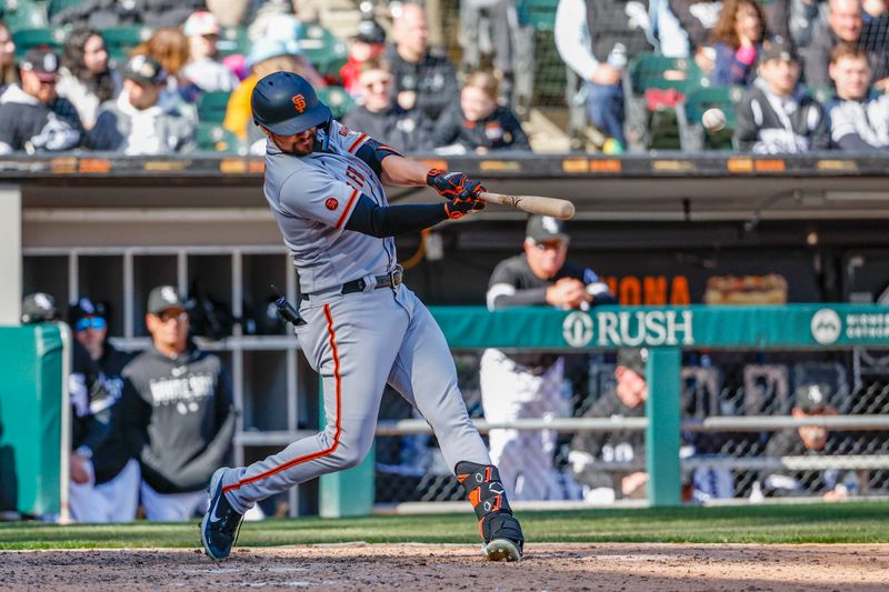 Apr 6, 2023; Chicago, Illinois, USA; San Francisco Giants first baseman J.D. Davis (7) hits a grand slam against the Chicago White Sox during the ninth inning at Guaranteed Rate Field. Mandatory Credit: Kamil Krzaczynski-USA TODAY Sports