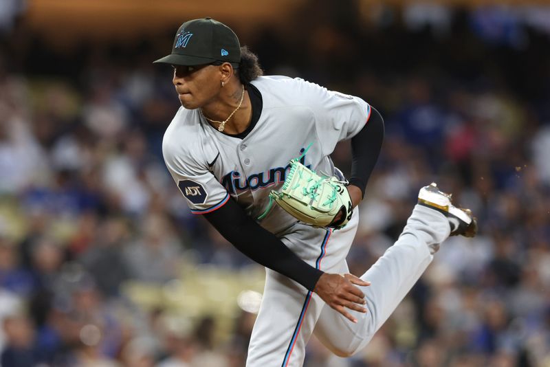 Apr 28, 2025; Los Angeles, California, USA; Miami Marlins pitcher Edward Cabrera (27) pitches in the second inning against the Los Angeles Dodgers at Dodger Stadium. Mandatory Credit: Jason Parkhurst-Imagn Images