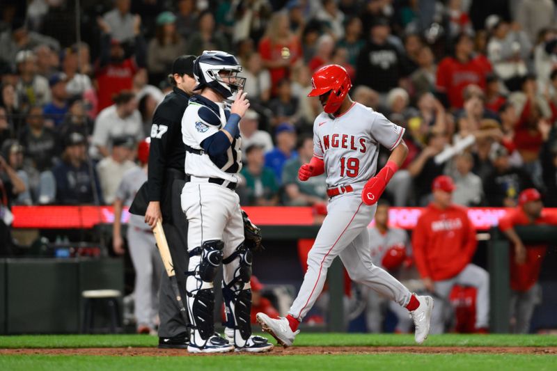 Sep 11, 2023; Seattle, Washington, USA; Los Angeles Angels second baseman Kyren Paris (19) scores a run against the Seattle Mariners during the eleventh inning at T-Mobile Park. Mandatory Credit: Steven Bisig-USA TODAY Sports