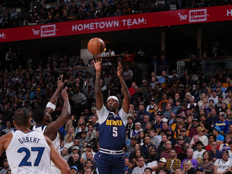 DENVER, CO - APRIL 10: Kentavious Caldwell-Pope #5 of the Denver Nuggets shoots a three point basket over Anthony Edwards #5 and Rudy Gobert #27 of the Minnesota Timberwolves during the game on April 10, 2024 at the Ball Arena in Denver, Colorado. NOTE TO USER: User expressly acknowledges and agrees that, by downloading and/or using this Photograph, user is consenting to the terms and conditions of the Getty Images License Agreement. Mandatory Copyright Notice: Copyright 2024 NBAE (Photo by Bart Young/NBAE via Getty Images)