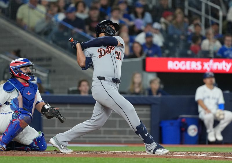 May 18, 2025; Toronto, Ontario, CAN; Detroit Tigers designated hitter Riley Greene (31) hits a single against the Toronto Blue Jays during the third inning at Rogers Centre. Mandatory Credit: Nick Turchiaro-Imagn Images