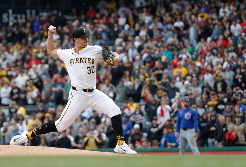 May 11, 2024; Pittsburgh, Pennsylvania, USA;  Pittsburgh Pirates starting pitcher Paul Skenes (30) delivers a pitch in his major league debut against the Chicago Cubs during the first inning at PNC Park. Mandatory Credit: Charles LeClaire-USA TODAY Sports