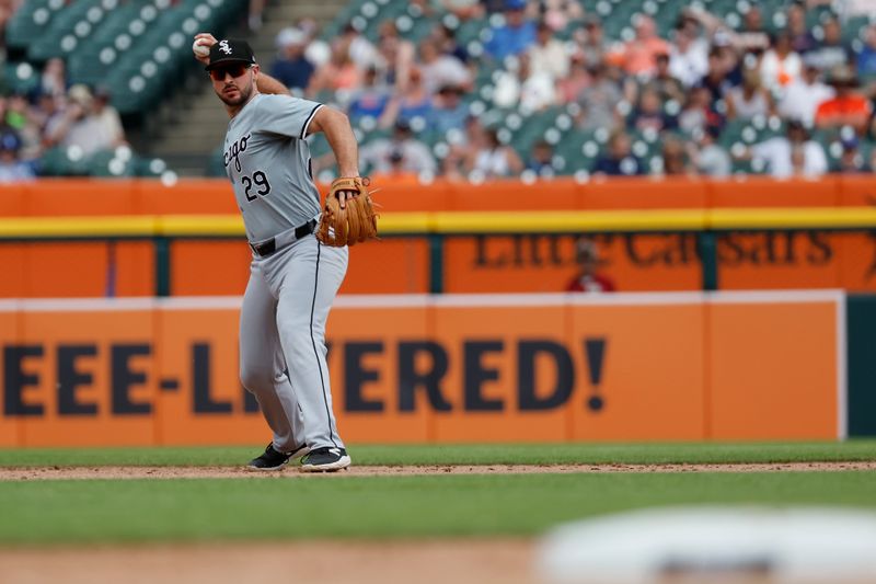 Jun 22, 2024; Detroit, Michigan, USA;  Chicago White Sox shortstop Paul DeJong (29) makes a throw to first base in the seventh inning against the Detroit Tigers at Comerica Park. Mandatory Credit: Rick Osentoski-USA TODAY Sports