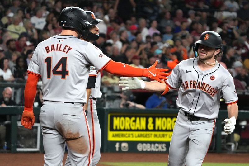Sep 24, 2024; Phoenix, Arizona, USA; San Francisco Giants shortstop Brett Wisely (0) cleebrates with catcher Patrick Bailey (14) after hitting a three-run home run against the Arizona Diamondbacks in the third inning at Chase Field. Mandatory Credit: Rick Scuteri-Imagn Images